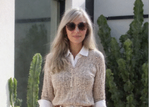 Lisa Flemming, creator of My Neutral Nest, walking outdoors in a neutral outfit